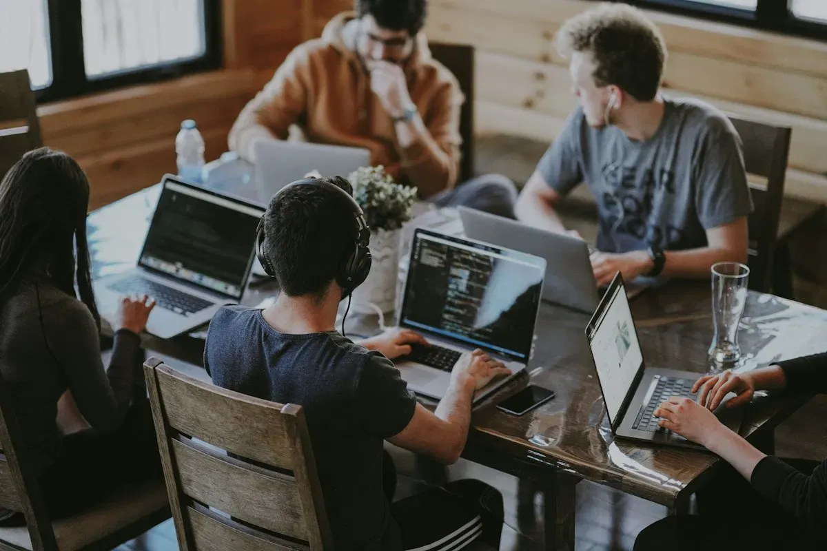 Local professionals working at a cafe table