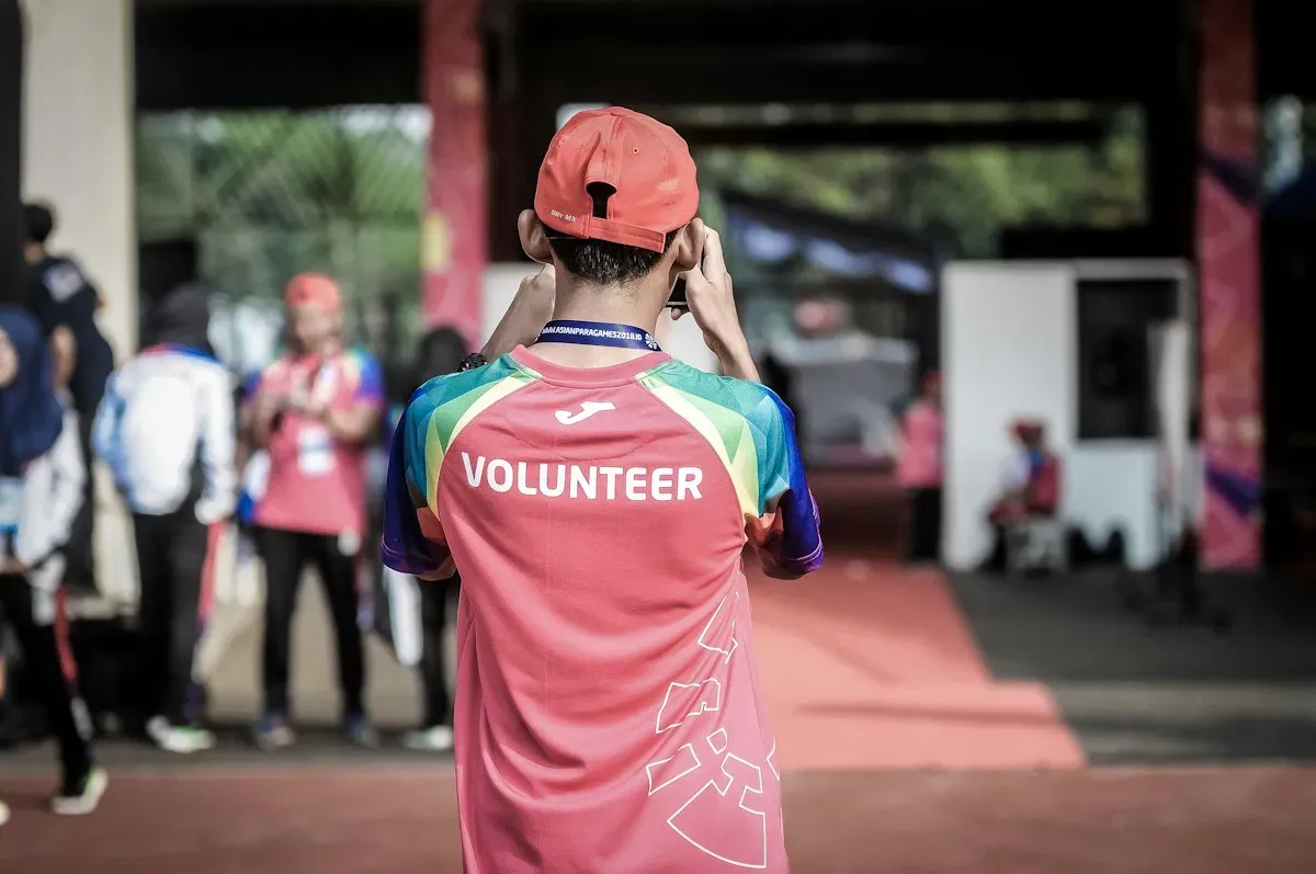 A volunteer capturing a community event